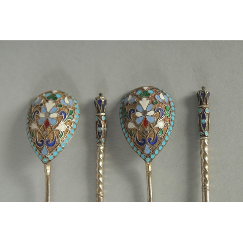 1420 - A SET OF FOUR RUSSIAN SILVER AND ENAMEL SPOONS. 10.5cm long. Marks: Head, 84. Weight: 42gms.