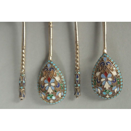 1420 - A SET OF FOUR RUSSIAN SILVER AND ENAMEL SPOONS. 10.5cm long. Marks: Head, 84. Weight: 42gms.