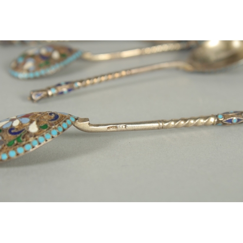 1420 - A SET OF FOUR RUSSIAN SILVER AND ENAMEL SPOONS. 10.5cm long. Marks: Head, 84. Weight: 42gms.