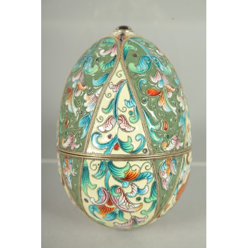 1425 - A RUSSIAN SILVER AND ENAMEL EGG 9cm long. 6cm diameter. Mark: Head, A.O. over 1891.