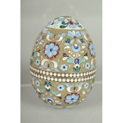 1426 - A RUSSIAN SILVER AND ENAMEL EGG 7cm high, 5cm diameter. Mark: 84.  Weight: 65gms.