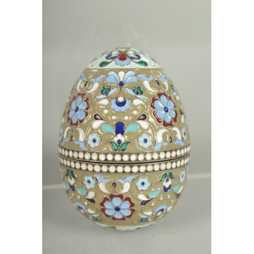 1426 - A RUSSIAN SILVER AND ENAMEL EGG 7cm high, 5cm diameter. Mark: 84.  Weight: 65gms.