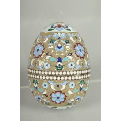 1426 - A RUSSIAN SILVER AND ENAMEL EGG 7cm high, 5cm diameter. Mark: 84.  Weight: 65gms.