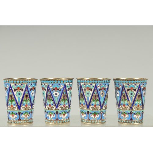 1427 - A SET OF FOUR RUSSIAN SILVER AND ENAMEL VODKA TOTS. 5cm high. Mark: Head, 84, K.T. Weight: 134gms.... 