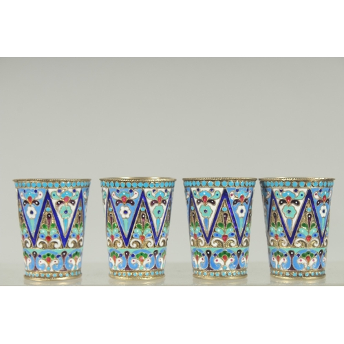 1427 - A SET OF FOUR RUSSIAN SILVER AND ENAMEL VODKA TOTS. 5cm high. Mark: Head, 84, K.T. Weight: 134gms.... 