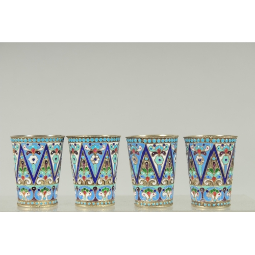 1427 - A SET OF FOUR RUSSIAN SILVER AND ENAMEL VODKA TOTS. 5cm high. Mark: Head, 84, K.T. Weight: 134gms.... 