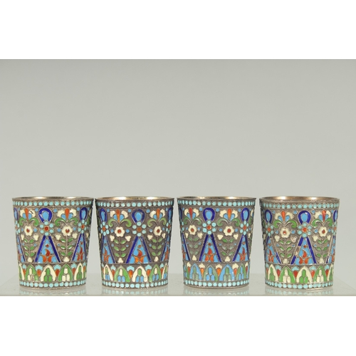 1428 - A SET OF FOUR RUSSIAN SILVER AND ENAMEL VODKA TOTS. 5cm high.  Mark: 84. A.A. over 1894. Weight: 157... 