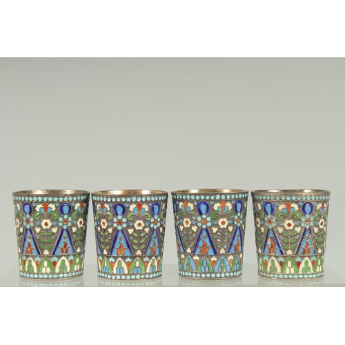 1428 - A SET OF FOUR RUSSIAN SILVER AND ENAMEL VODKA TOTS. 5cm high.  Mark: 84. A.A. over 1894. Weight: 157... 