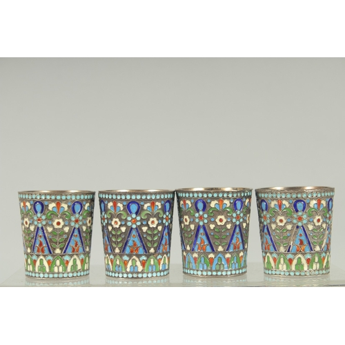 1428 - A SET OF FOUR RUSSIAN SILVER AND ENAMEL VODKA TOTS. 5cm high.  Mark: 84. A.A. over 1894. Weight: 157... 