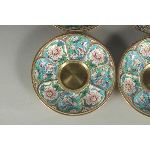 1433 - A GOOD SET OF FOUR RUSSIAN SILVER AND ENAMEL SAUCERS. 11.5cm diameter. Mark: Head, 84, A.C. over 189... 