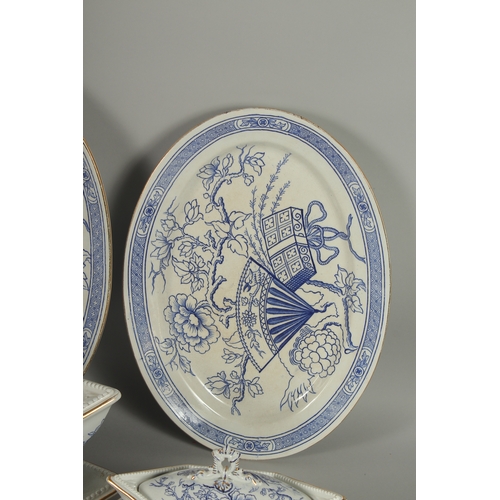 1094 - A CHRISTOPHER DRESSER DESIGN BLUE AND WHITE PART DINNER SET COMPRISING: Three oval dishes, 18ins, 16... 