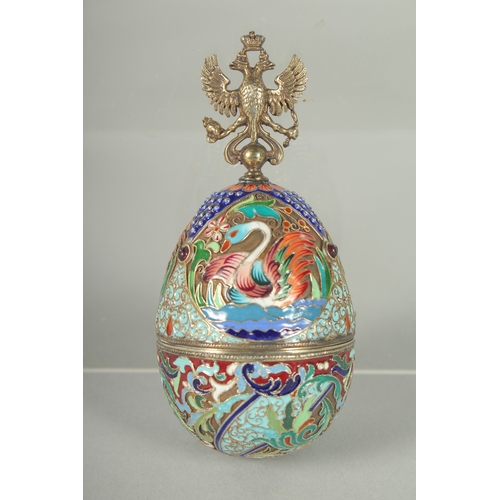 1424 - A RUSSIAN SILVER AND ENAMEL EGG (matching previous lot). 10cm long Mark: Head, 84, C.K. Weight: 64gm... 