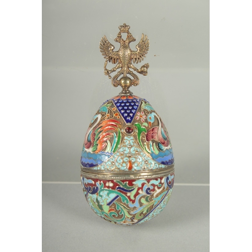 1424 - A RUSSIAN SILVER AND ENAMEL EGG (matching previous lot). 10cm long Mark: Head, 84, C.K. Weight: 64gm... 