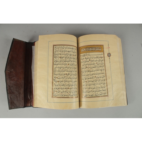 243 - A 19TH CENTURY OTTOMAN TURKISH QURAN, signed Hafiz Uthman al-Fawzi and dated 1258H./1842
Fifteen lin... 