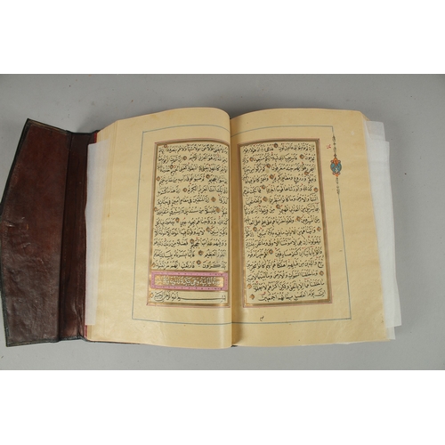 243 - A 19TH CENTURY OTTOMAN TURKISH QURAN, signed Hafiz Uthman al-Fawzi and dated 1258H./1842
Fifteen lin... 