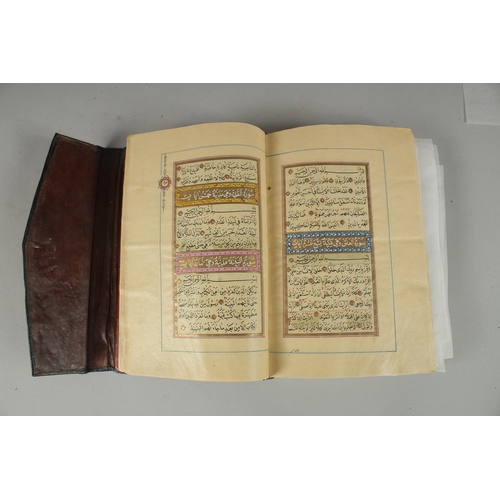 243 - A 19TH CENTURY OTTOMAN TURKISH QURAN, signed Hafiz Uthman al-Fawzi and dated 1258H./1842
Fifteen lin... 