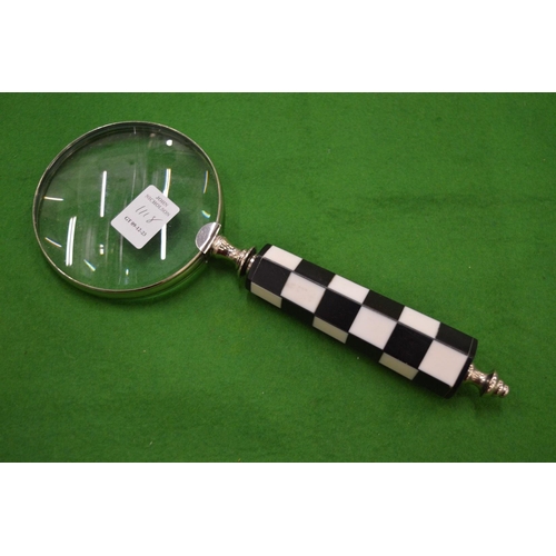 1118 - A magnifying glass.