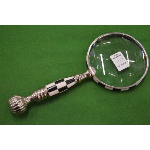 1119 - A magnifying glass.