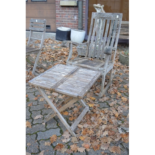 8 - A carved hardwood rocking chair and a folding table.