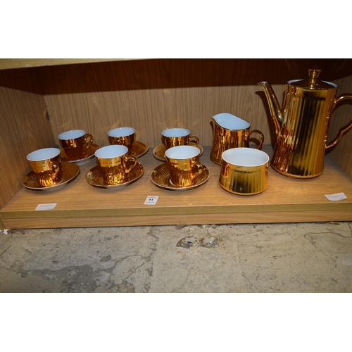 81 - Gilt decorated coffee service.