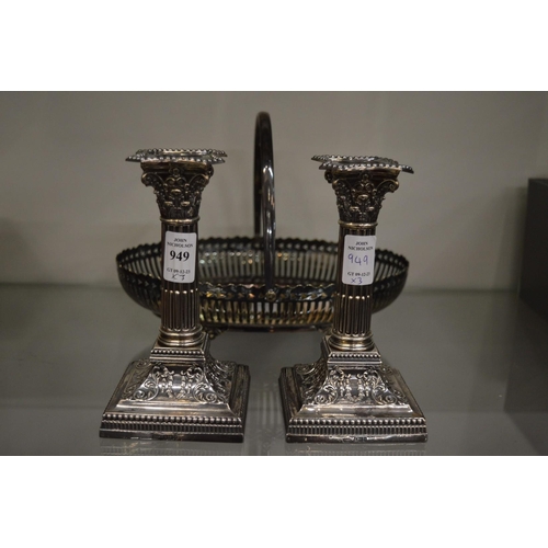 949 - A good pair of silver corinthian column candlesticks together with a plated basket.