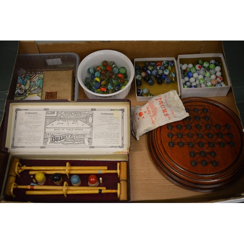 952 - Toys and games to include solitaire board, various marbles, table croquet set, boxed etc.