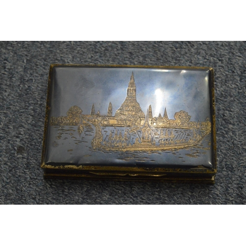 968 - A silver cigarette box, pair of plated candelabra and other items.