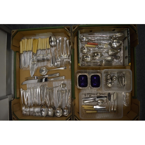 970 - Two boxes of plated items to include flatware, cruets etc.