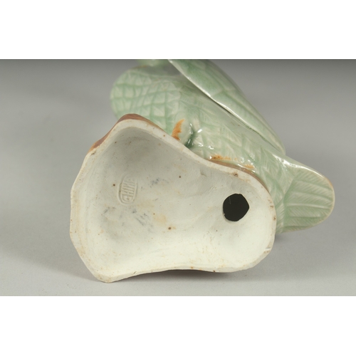 12 - A CHINESE REPUBLIC PERIOD CELADON PORCELAIN FIGURE OF A DUCK, with impressed mark to base, 20.5cm hi... 