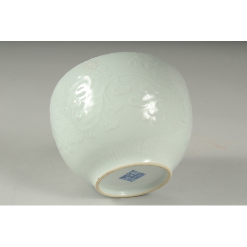 14 - A CHINESE REPUBLIC PERIOD WHITE CELADON PORCELAIN POT, with carved ruyi stylised foliate decoration,... 