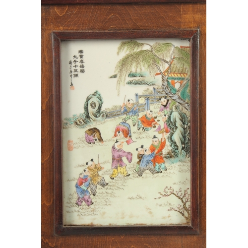 15 - A CHINESE REPUBLIC FAMILLE ROSE PORCELAIN PLAQUE, inset within a hardwood frame, panel depicting an ... 