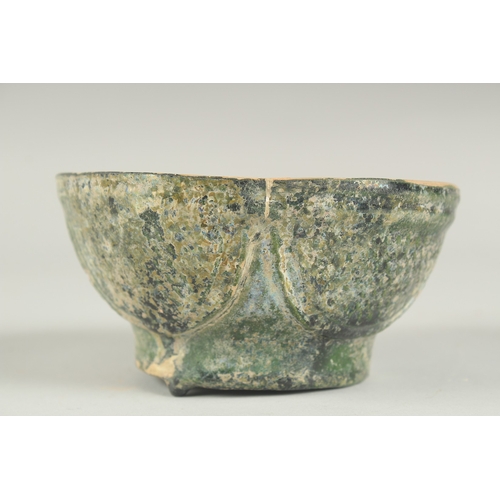 169 - A RARE 8TH - 9TH CENTURY UMAYYAD GREEN GLAZED POTTERY BOWL, 12.5cm diameter.