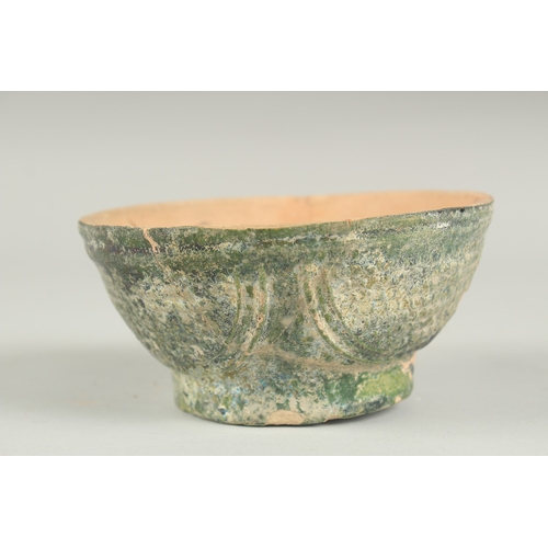 169 - A RARE 8TH - 9TH CENTURY UMAYYAD GREEN GLAZED POTTERY BOWL, 12.5cm diameter.