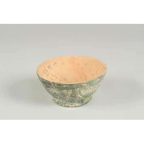 169 - A RARE 8TH - 9TH CENTURY UMAYYAD GREEN GLAZED POTTERY BOWL, 12.5cm diameter.