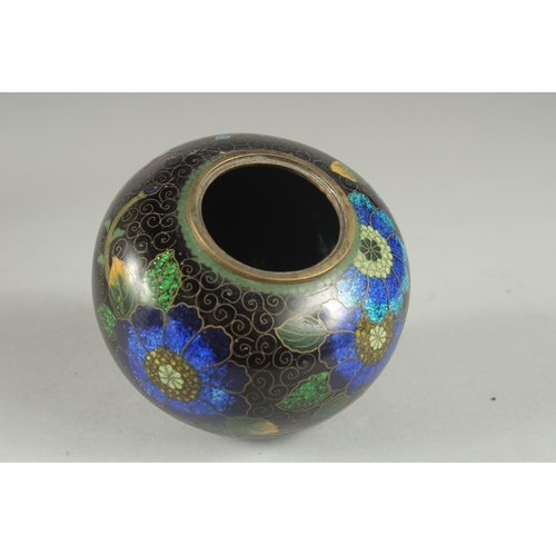 2 - A BLACK GROUND CLOISONNE JAR AND COVER, with glittered enamel flowers, 11cm high.