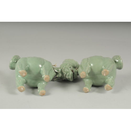 20 - A PAIR OF CHINESE CELADON GLAZED PORCELAIN FIGURAL CENSER BURNERS, in the form of mythical beasts wi... 