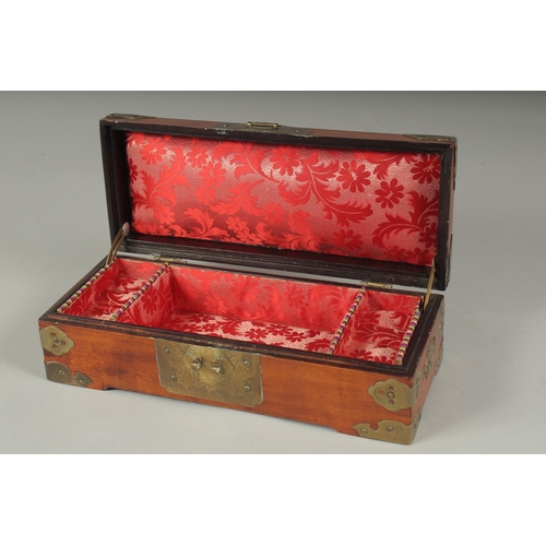 21 - A LATE 19TH - EARLY 20TH CENTURY CHINESE JADE MOUNTED HARDWOOD BOX, the hinged lid inset with three ... 