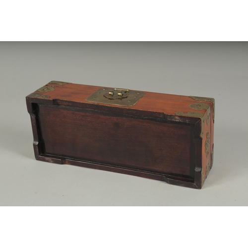 21 - A LATE 19TH - EARLY 20TH CENTURY CHINESE JADE MOUNTED HARDWOOD BOX, the hinged lid inset with three ... 