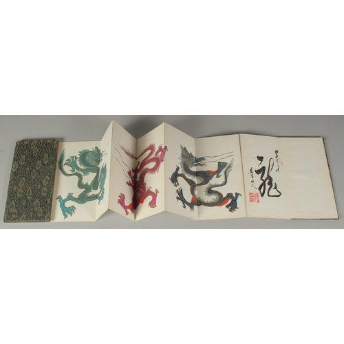 23 - A CHINESE FOLD-OUT BOOK OF DRAGON PAINTINGS, inscription to the inner leaf with two red seal stamps,... 