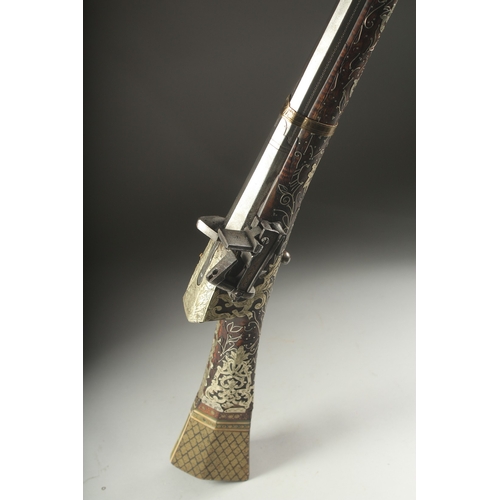 261 - A VERY FINE OTTOMAN TURKISH SILVER, BRASS, AND BONE INLAID FLINTLOCK RIFLE, with watered steel barre... 