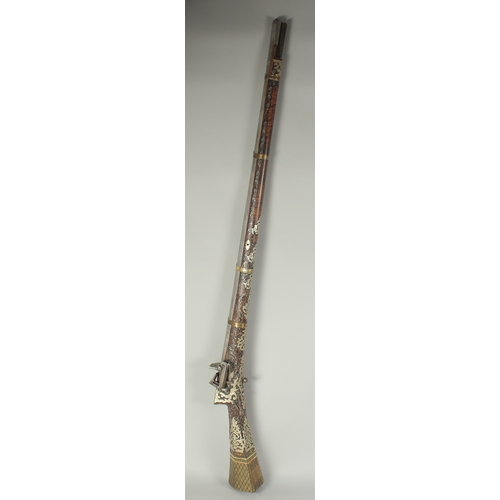 261 - A VERY FINE OTTOMAN TURKISH SILVER, BRASS, AND BONE INLAID FLINTLOCK RIFLE, with watered steel barre... 