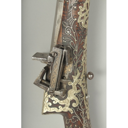 261 - A VERY FINE OTTOMAN TURKISH SILVER, BRASS, AND BONE INLAID FLINTLOCK RIFLE, with watered steel barre... 