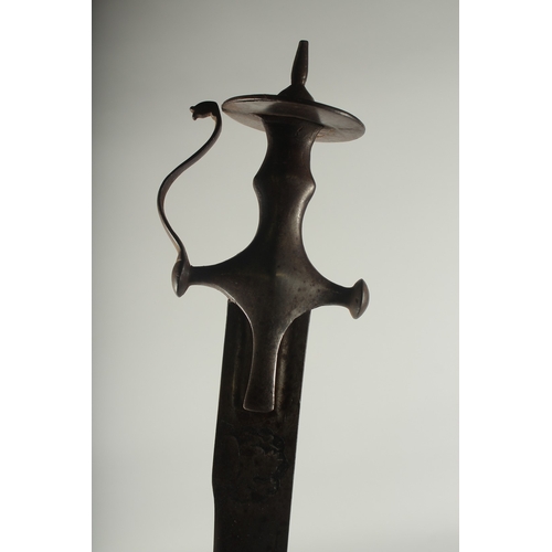 262 - A FINE 18TH CENTURY SOUTH INDIAN TULWAR SWORD, the blade with engraved Hindu deities, 93cm overall.