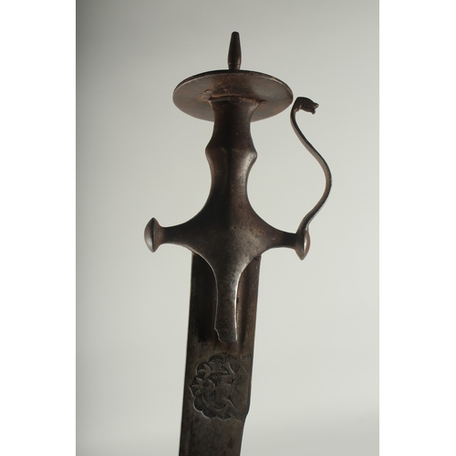 262 - A FINE 18TH CENTURY SOUTH INDIAN TULWAR SWORD, the blade with engraved Hindu deities, 93cm overall.