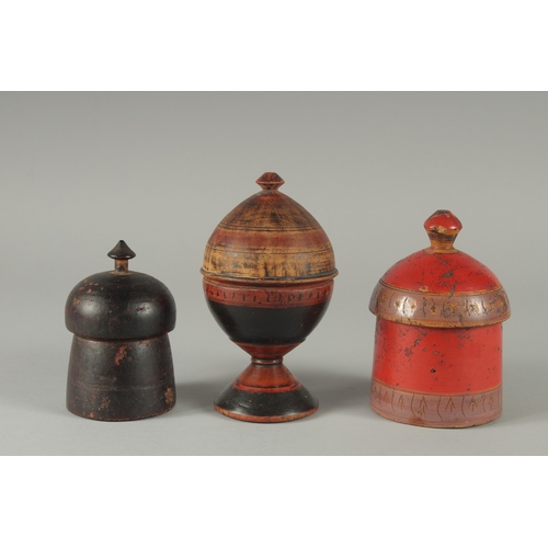 266 - A COLLECTION OF THREE 19TH CENTURY INDIAN TURNED WOODEN CONTAINERS, tallest 16cm high, (3).