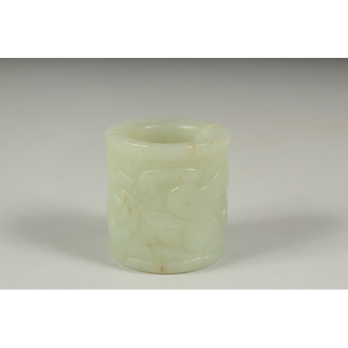 27 - AN EARLY 20TH CENTURY CHINESE CARVED JADE RING, 3.5cm long.