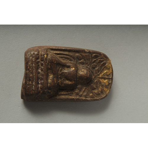 29 - A SMALL 19TH CENTURY TIBETAN BUDDHISTIC AMULET, 6cm x 3.5cm.