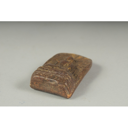 29 - A SMALL 19TH CENTURY TIBETAN BUDDHISTIC AMULET, 6cm x 3.5cm.