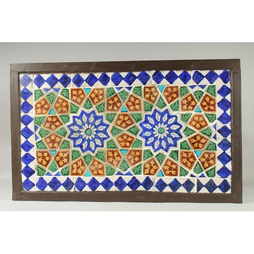 291 - A FINE LARGE 19TH CENTURY INDIAN GLAZED POTTERY TILED PANEL, inset within a wooden frame; possibly a... 