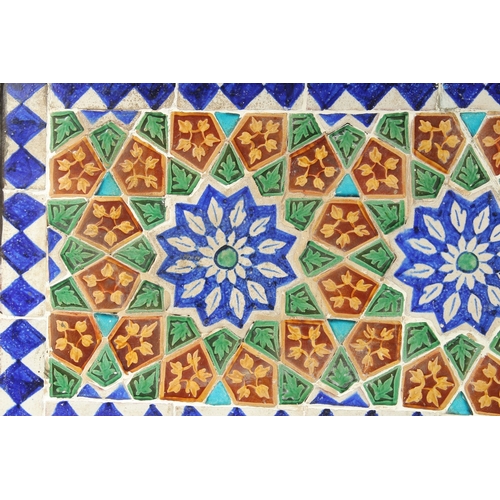 291 - A FINE LARGE 19TH CENTURY INDIAN GLAZED POTTERY TILED PANEL, inset within a wooden frame; possibly a... 